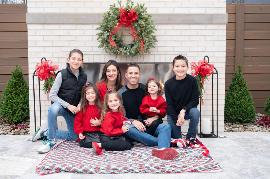 beautiful family photos at your own home in front of fireplace