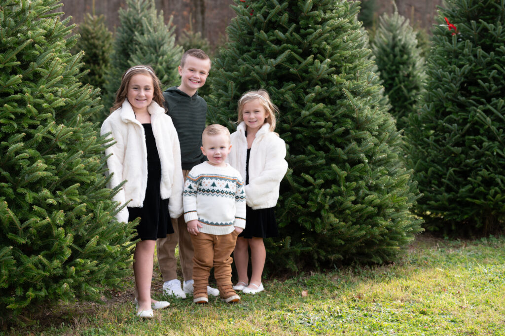 cousins holiday photo at xmas tree farm